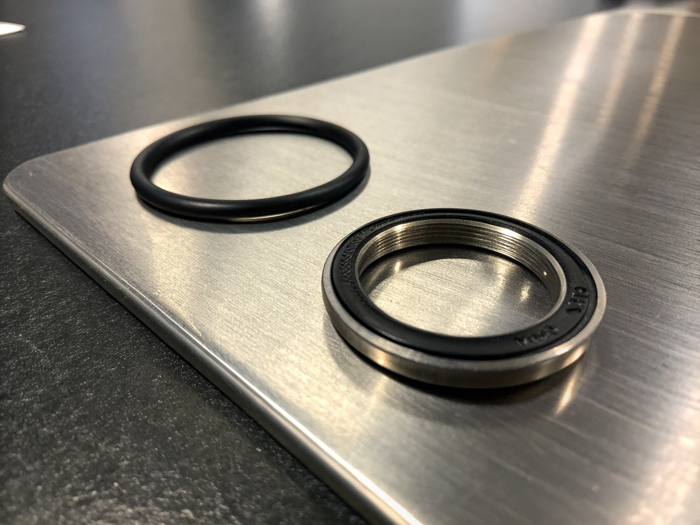 Close-up of EMC shielding gaskets and precision welded seams on enclosure