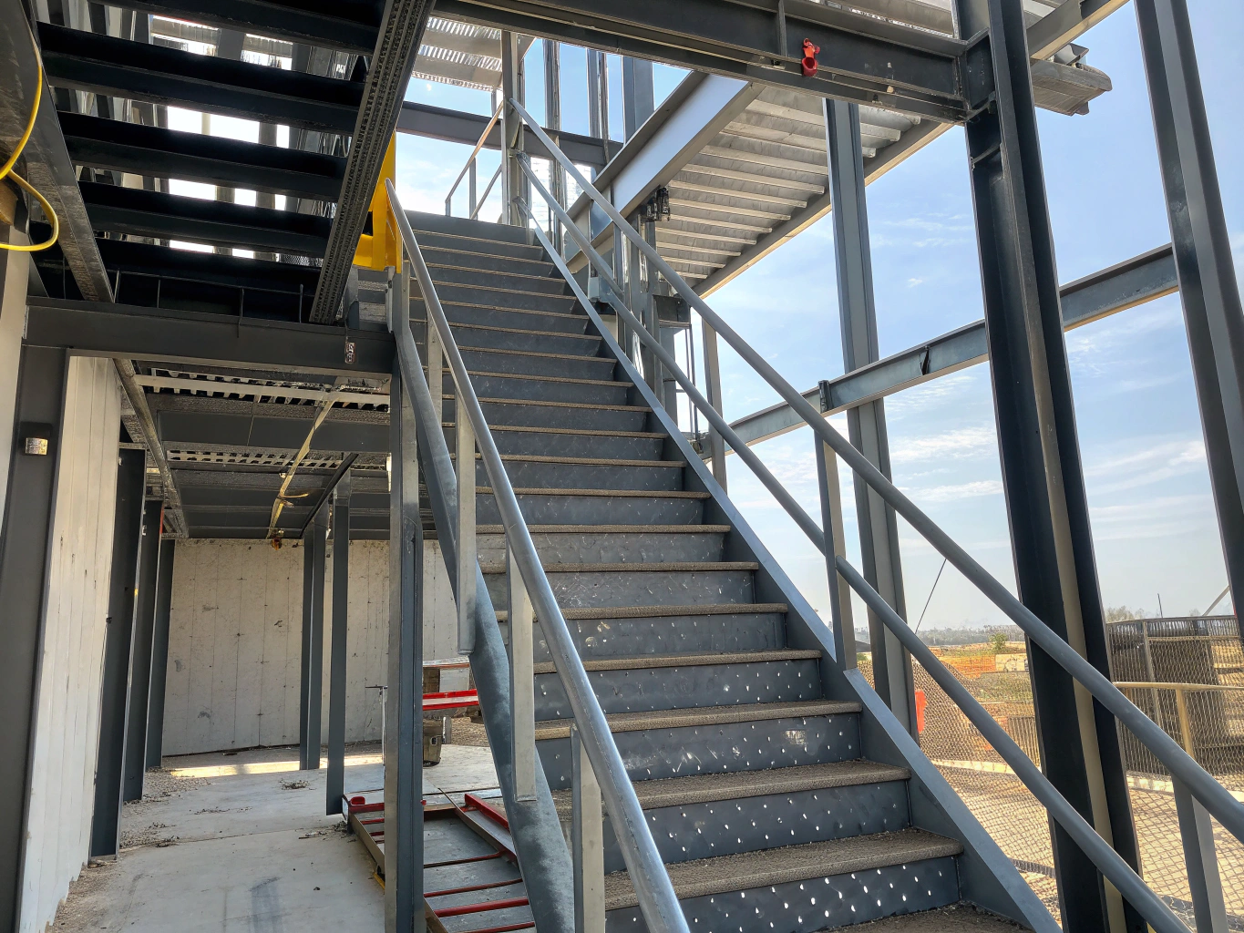 Public infrastructure metal guardrail panels and durable stair treads